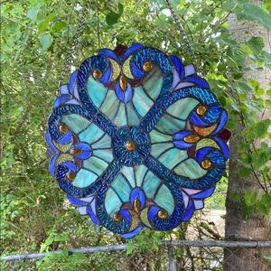Stained Glass Hanging Art with Blue and Gold Accents. Approximately 12” across